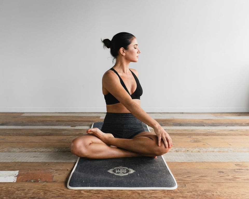 Woman seated on a yoga mat